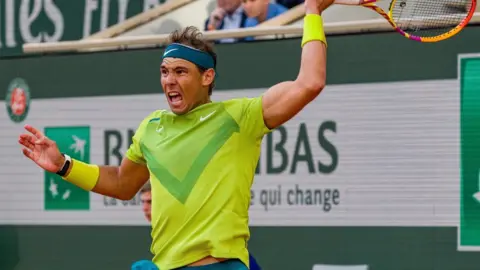 Getty Images Rafael Nadal of Spain plays a forehand against Felix Auger-Aliassime of Canada during the Men&#x27;s Singles Fourth Round match on Day 8 of The 2022 French Open at Roland Garros on May 29, 2022