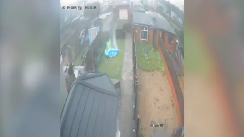 A home security camera captures a tornado sweeping through gardens in a Conuty Durham village