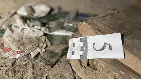 BBC Forensics team marker in Bucha basement